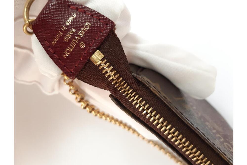 Sold at Auction: Limited Edition Mini Pochette Wristlet, Evasion, Louis  Vuitton