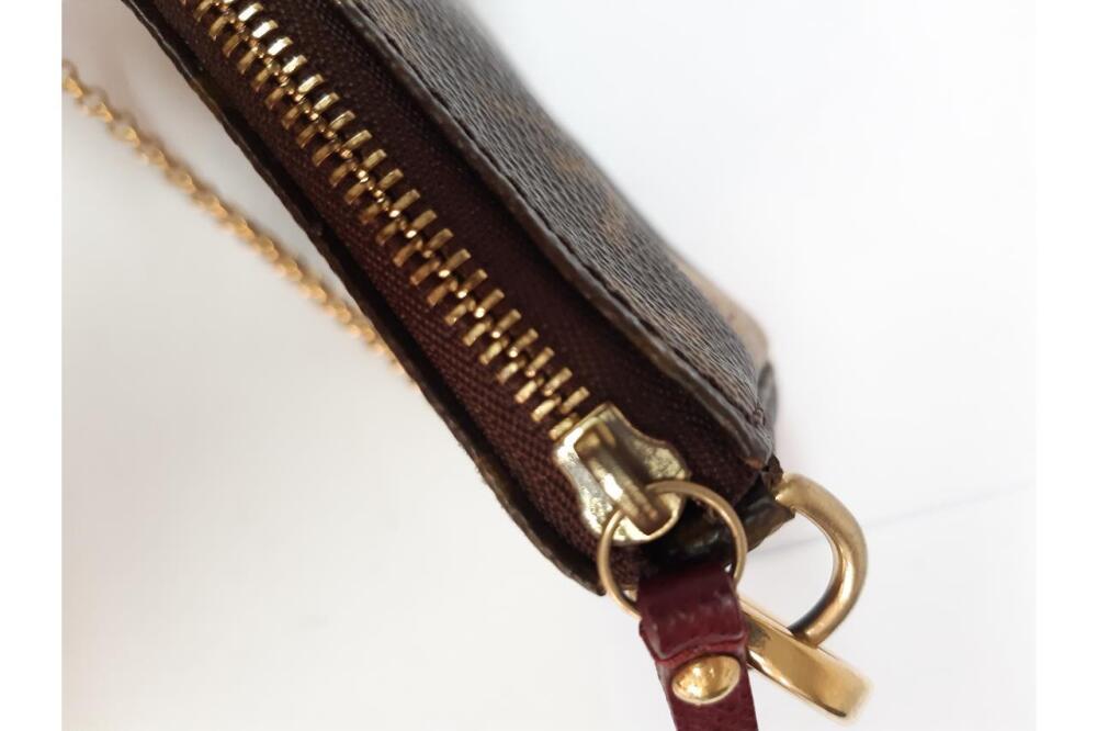 Louis Vuitton 2000 Monogram Pochette Accessories Shoulder Bag. Single top  handle. Top zip closure. Brown interior lining. Open interior.…