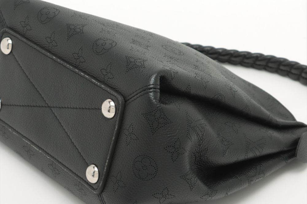 At Auction: Louis Vuitton, Louis Vuitton Babylone Handbag Mahina Leather BB  Black